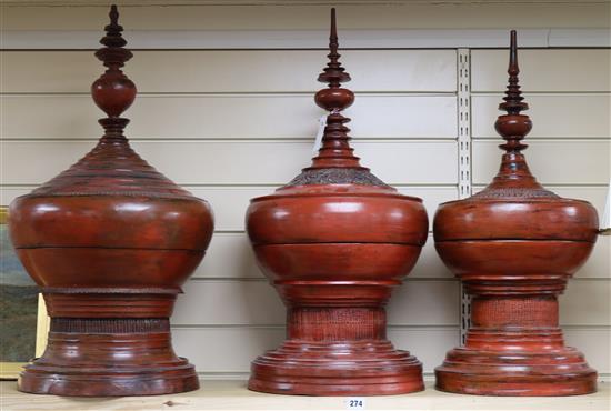 Three large red Burmese lacquered temple shaped pedestal boxes and covers